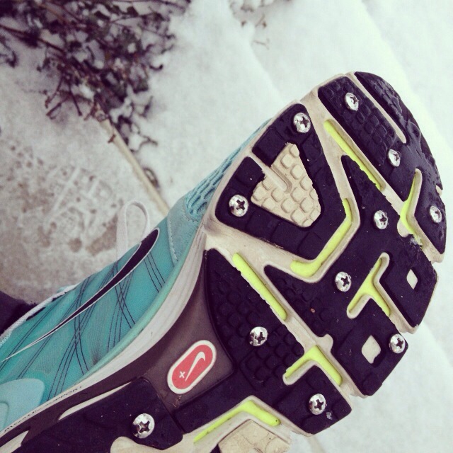 Runnin shoe with screws to keep from slipping on ice